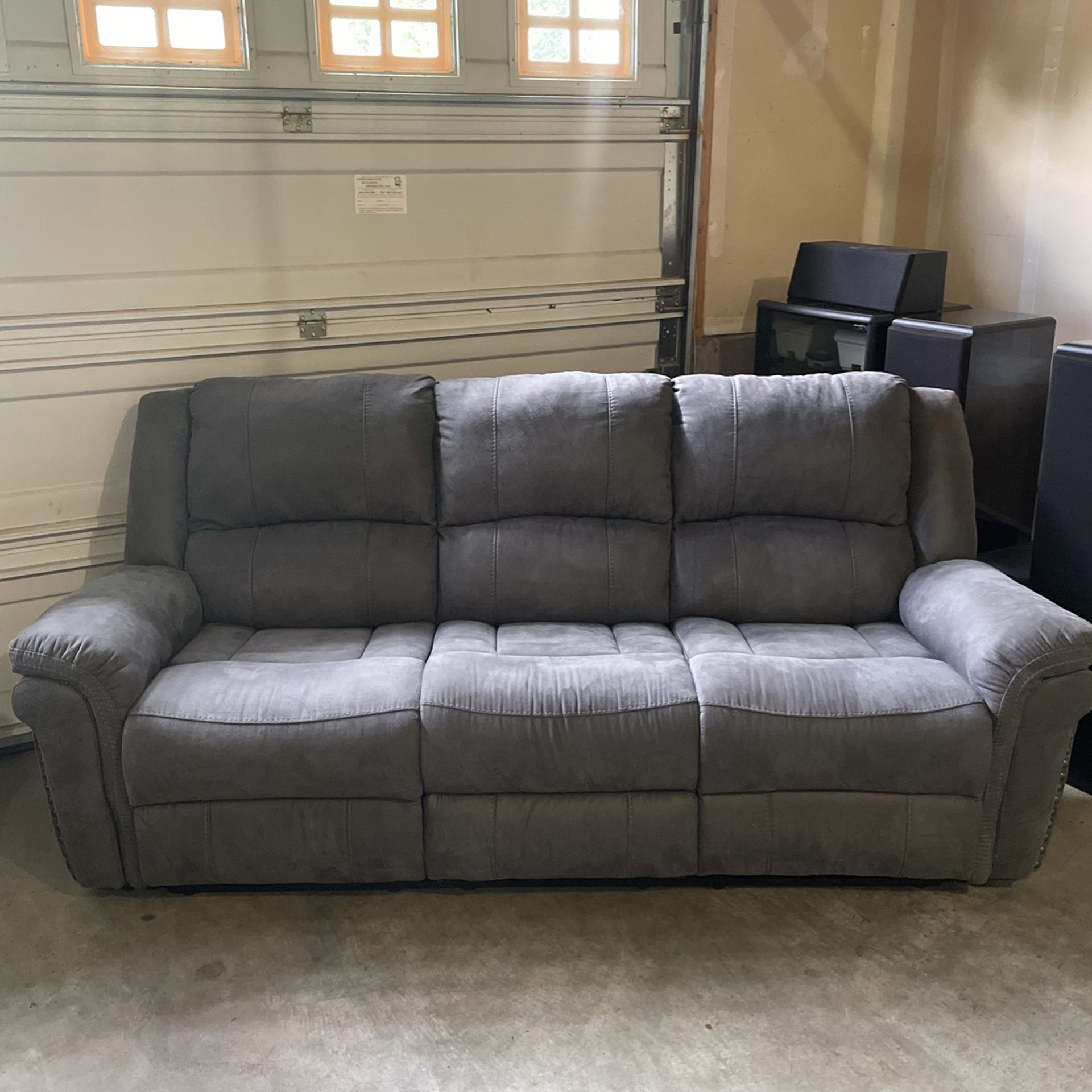 Grey Colored Couch with Reclining Chairs