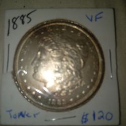 1885p Morgan Silver Dollar ( Toned )