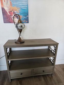Grey bookshelf with star detailing