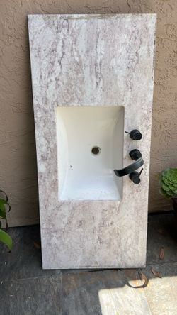 Bathroom sink and marble counter.