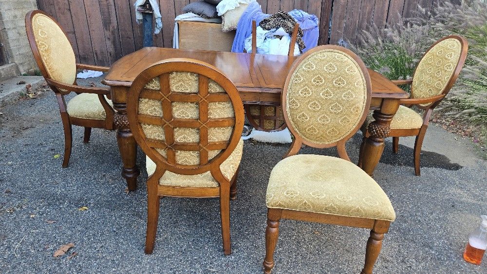 Tommy Bahama Lexington dining table with Lexington French medallion dining chairs