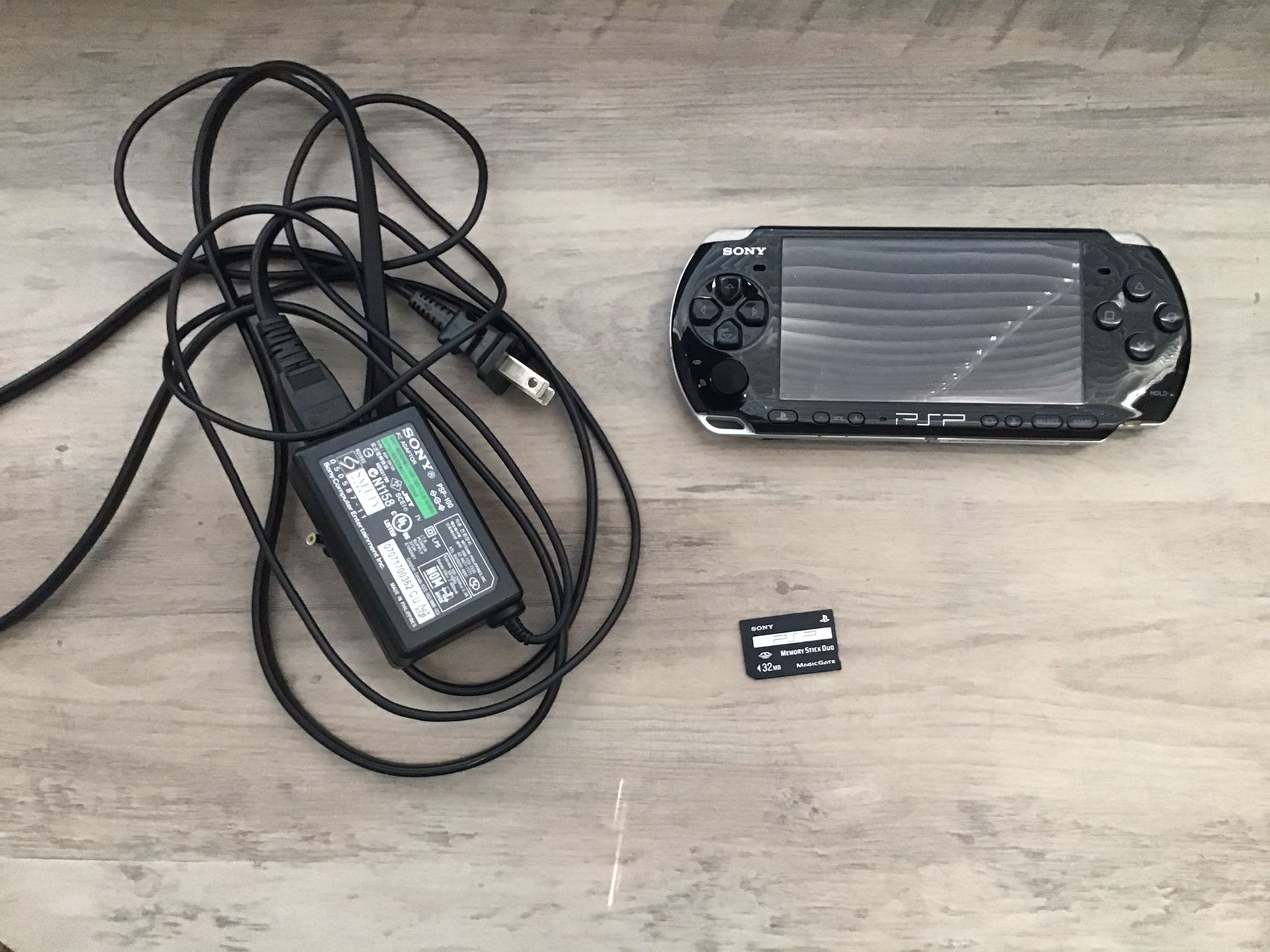 PSP, PSP Sony Charger, and 32MB PSP Sony Memory Stick