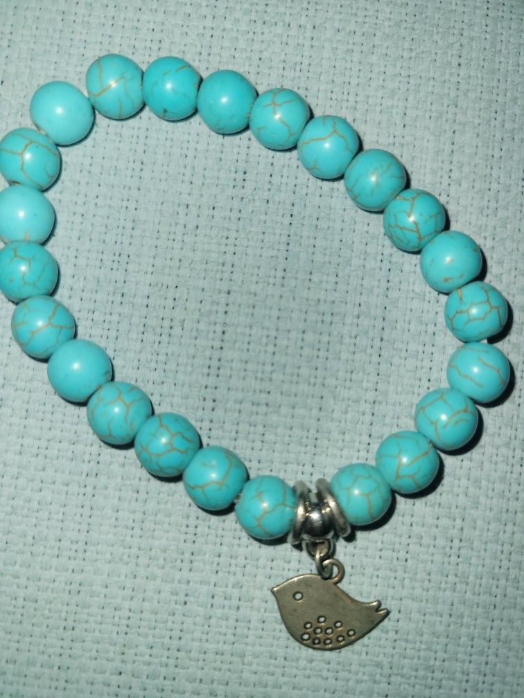 Turquoise Colored Stretch Bird Charm Braceket