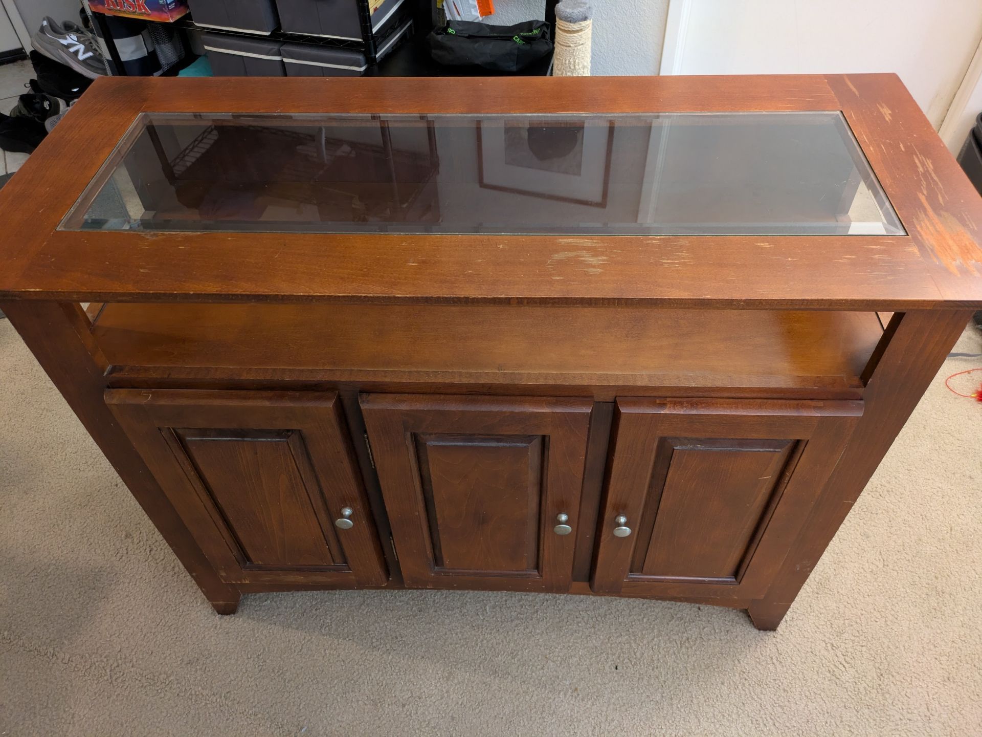 Wooden credenza with glass top