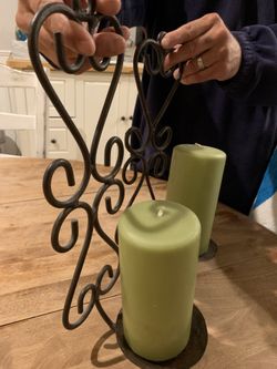 Rod iron candle holders with candles