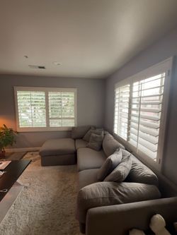 Gray members mark couch with ottoman