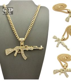 Hip hop iced out Ak 47 gold style pendent.