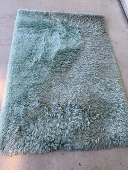 Area rug 57” x 81”