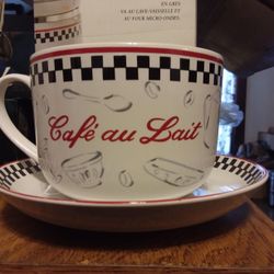  Coffee cups with saucers and coffee canister. 
