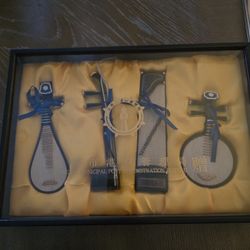 Wooden box with 4 miniature musical instruments for collection