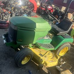 John Deere 325 rider with snowplow