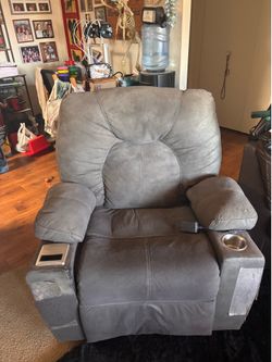 Gray recliner with cup holder and wireless charger