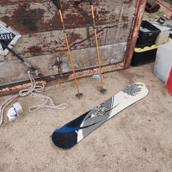 snowboard and ski poles
