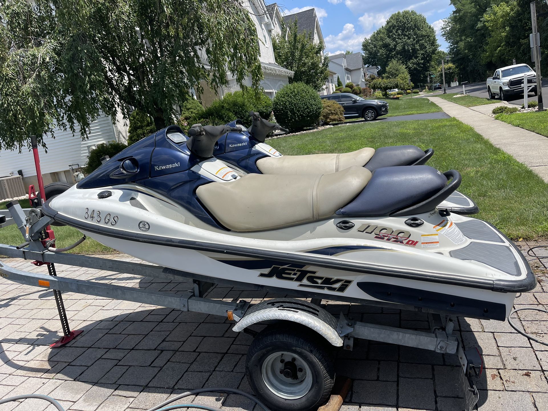 Two 2001 Kawasaki STX 3 seaters And Trailer