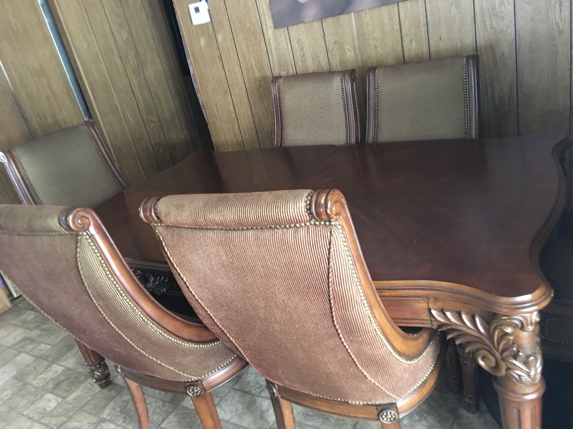 Solid wood dining table with six chairs and two extended if you want to make it bigger