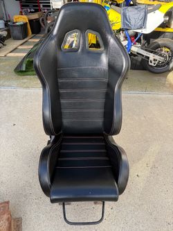 Reclining bucket seats