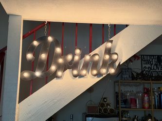lit “Drink” sign
