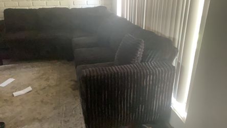 black sectional fluffy couch