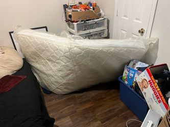 One lightly used Twins size mattress stun in original plastic rap