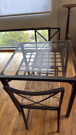 Cute dining room table with 2 chairs.