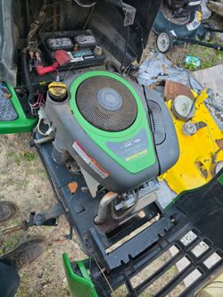 2 john deere mowers