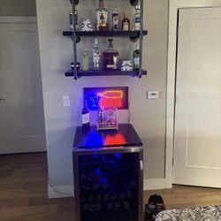 Bar Setup: Mini Fridge, Floating Shelves, Neon Sign