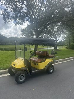 Yellow EZGO Golf Cart