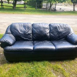 Leather couch
33" tall x 74" long x 32" deep
Low profile
Cushions are not removable
Minor wear in leather, overall great condition