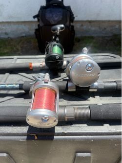 3 - Daiwa Saltist reels with rods and tackle bag