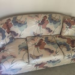 Vintage floral pattern couch with throw pillows