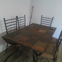 Antigo slate-top dining table. 