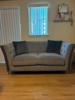 Gray Tufted Couches with Nailhead Trim