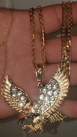 Cadena de oro laminado con dije águila con zirconia
