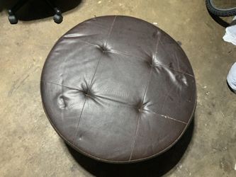 Brown round ottoman