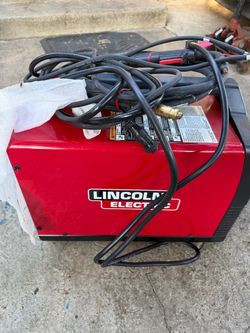 Lincoln Electric Welder with Helmet and Accessories Kit