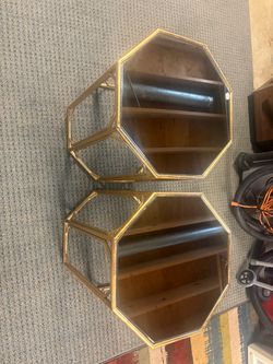 Octagonal glass top steel end table.