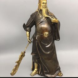 A solid brass Guan Gong statue. 