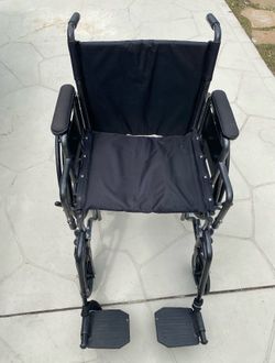 Invacare Essentials Foldable Manual Wheelchair w/ Swing-Away Footrests & Desk Arms