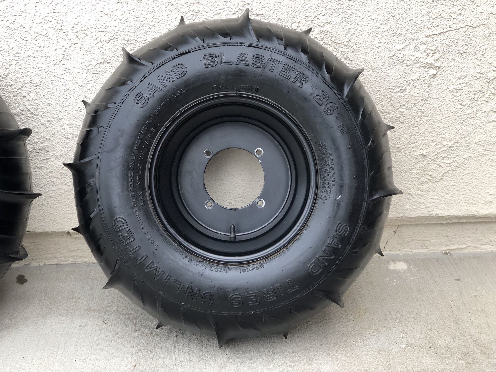 Paddle tires RZRRears are Sand Tires UnlimitedSand Blaster 26" tire