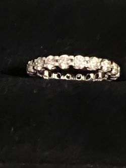Beautiful 2.2 moissanite fire round band 10 karat white gold. New and never worn have certification card.