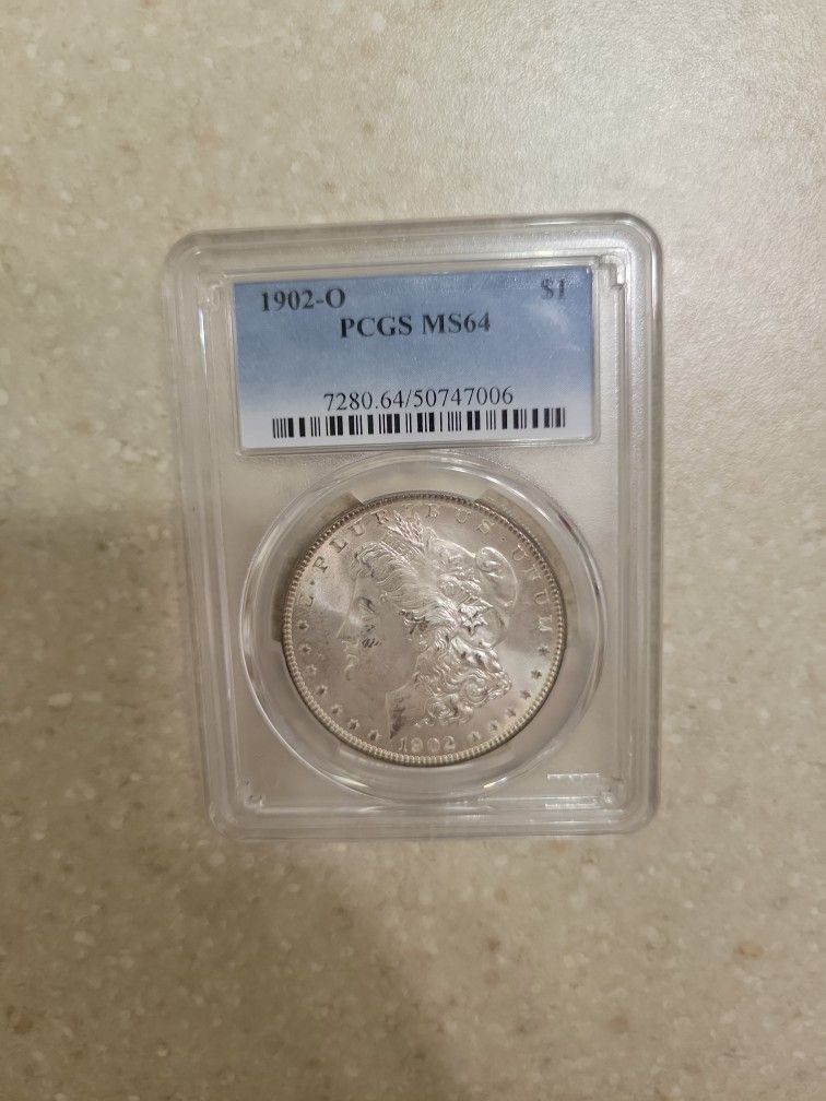 1902 O Morgan Silver Dollar. Graded