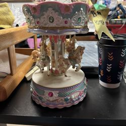 Carousel pretty no previous owners sat in an antique shop in a glass case 