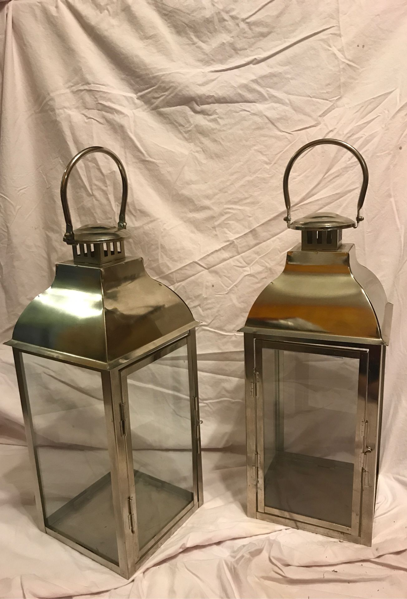 Two silver lanterns
