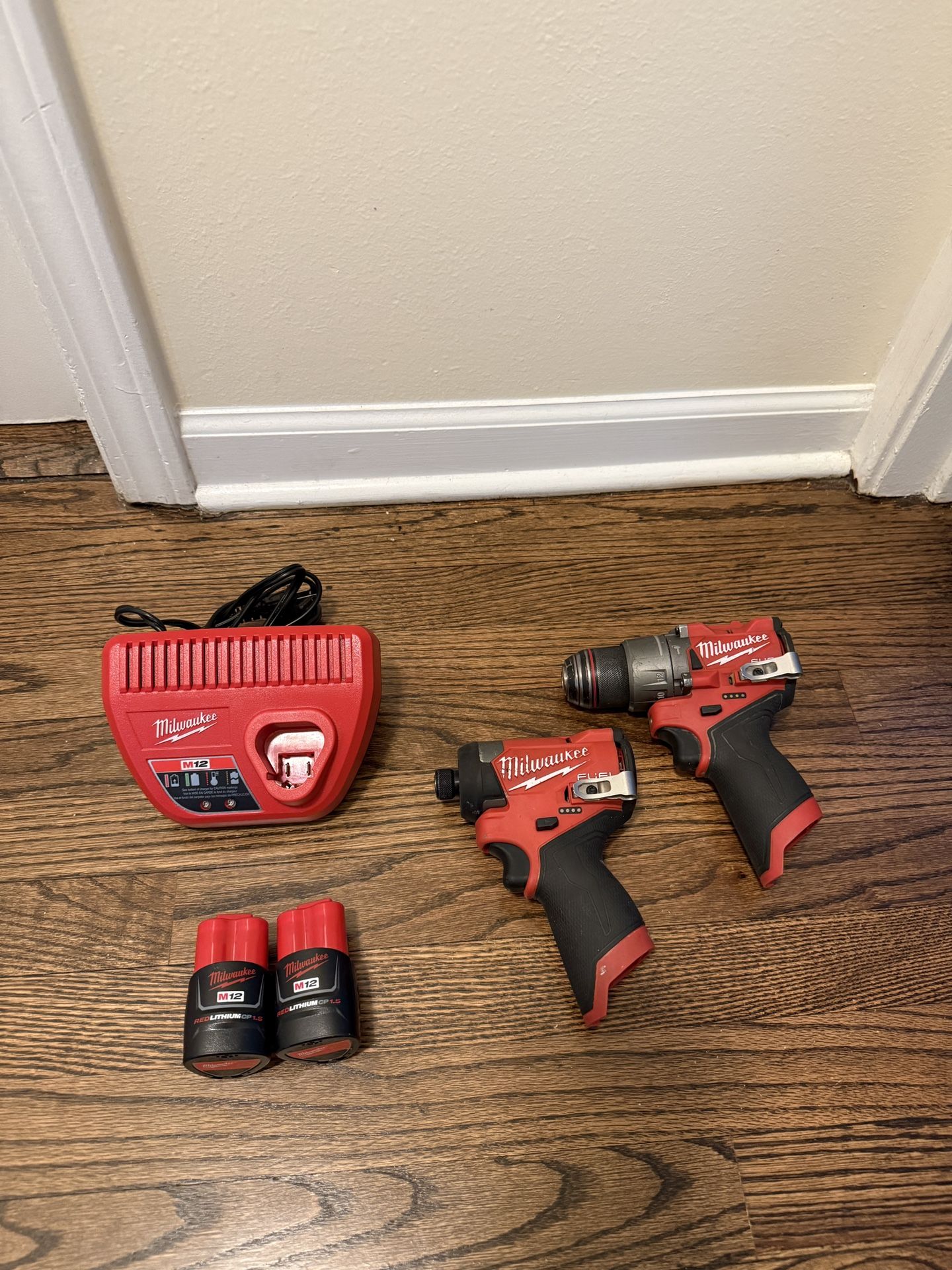 M12 Milwaukee Fuel impact driver & drill with (2) 1.5Ah battery and charger