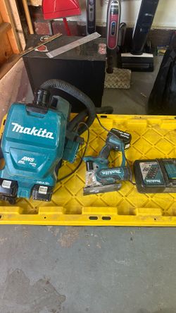 Makita vacuum and drywall cut out saw.