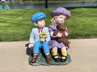 Beautiful Concrete Boy And Girl On Bench