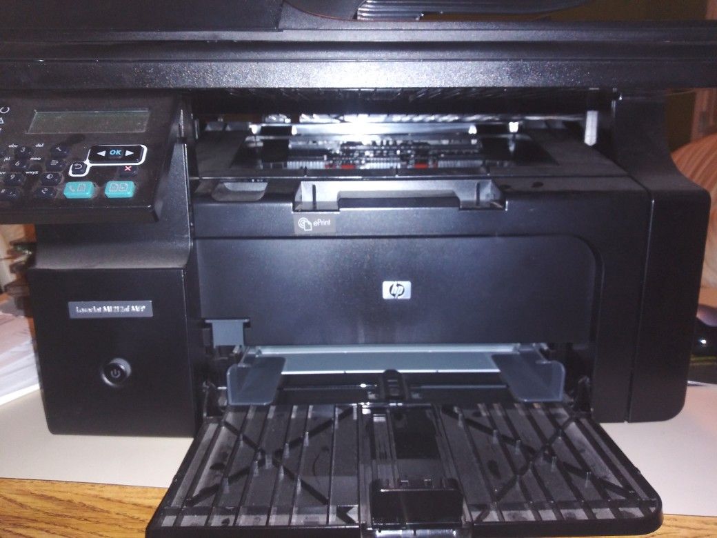 Hp printer laserjet m1212nf mfp.