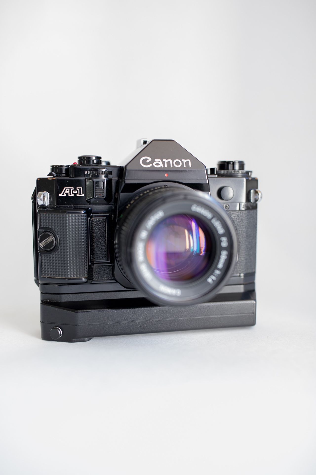 Canon A-1 35mm slr film camera w/ Canon FD 50mm F 1.4 + A2 power winder.