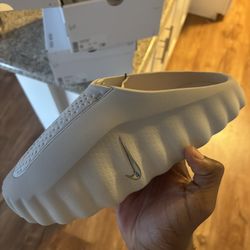 Size 9 W / 7.5 MEN Nike WMNS Mind 001 “Light Smoke Grey”