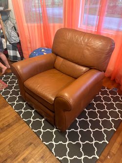 Brown leather recliner wall hugger
